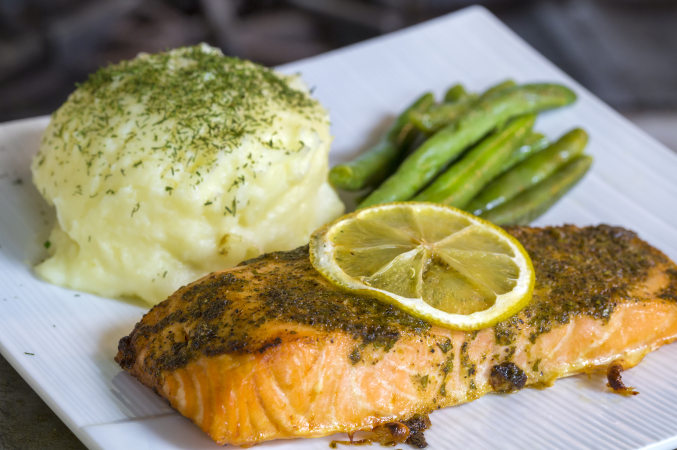 LUC banquet / wedding reception catering - grilled salmon covered with herbs and lemon slice, mashed potato medallion covered with fresh dill, and sauteed and or steamed asparagus.